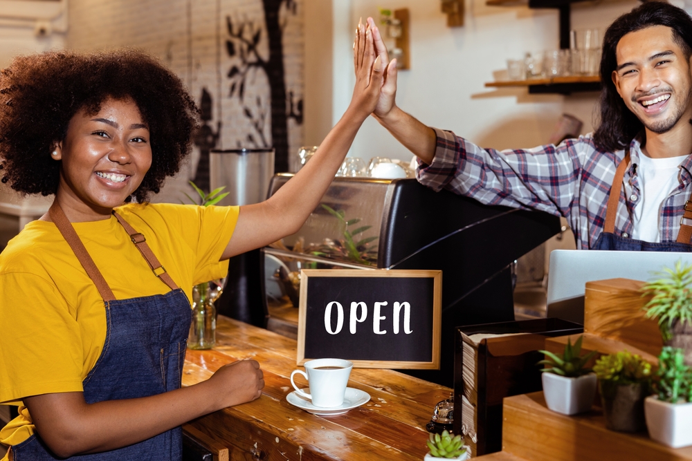 Small business owners giving high five