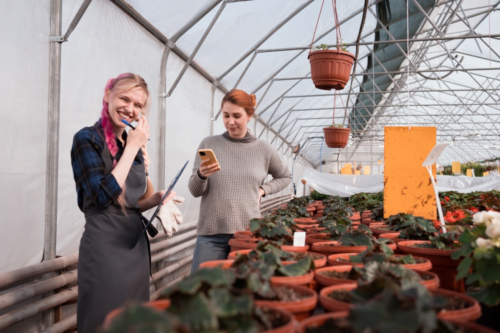 small business owners in a greenhouse